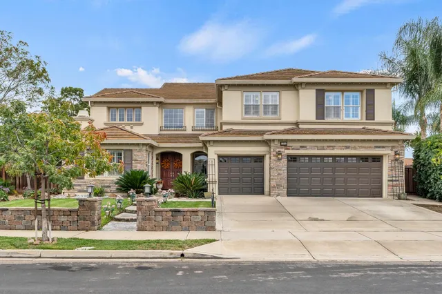 a living room with furniture fireplace and flower vase