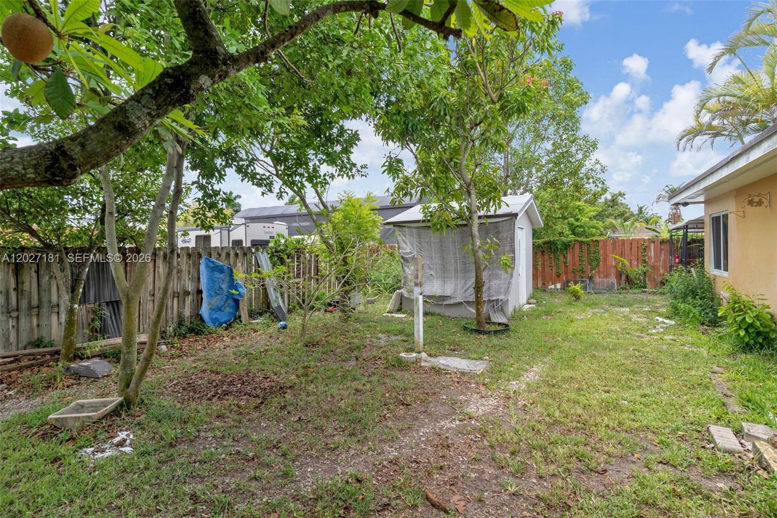 15440 Southwest 294th Terrace Homestead, FL 33033 - Photo 23 of 31 a view of a house with backyard and a tree