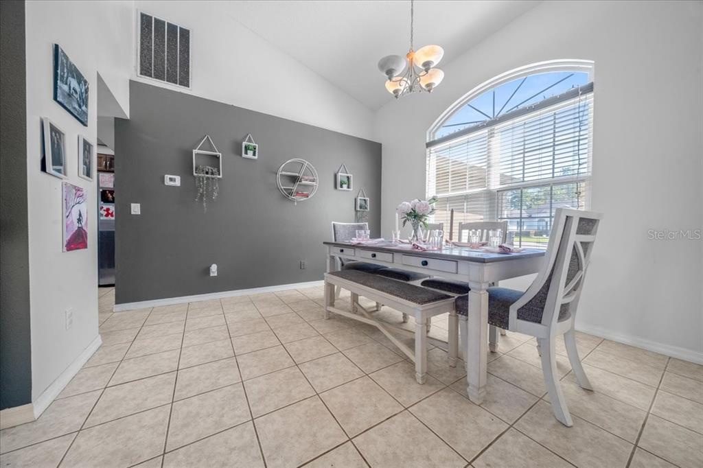 5365 Southwest 111th Lane Road Ocala, FL 34476 - Photo 17 of 42 a view of a dining room with furniture