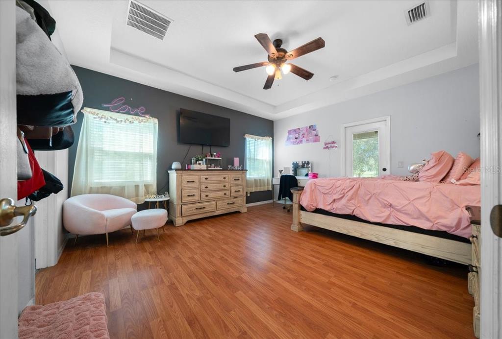 5365 Southwest 111th Lane Road Ocala, FL 34476 - Photo 20 of 42 a bedroom with a bed couch and a window