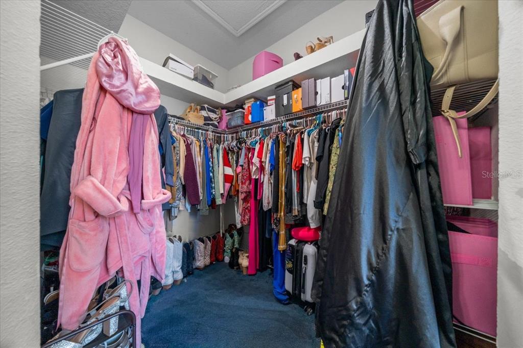 5365 Southwest 111th Lane Road Ocala, FL 34476 - Photo 28 of 42 a view of walk in closet with clothes