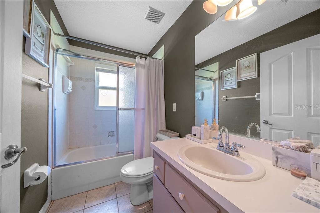 5365 Southwest 111th Lane Road Ocala, FL 34476 - Photo 32 of 42 a bathroom with a sink toilet and shower