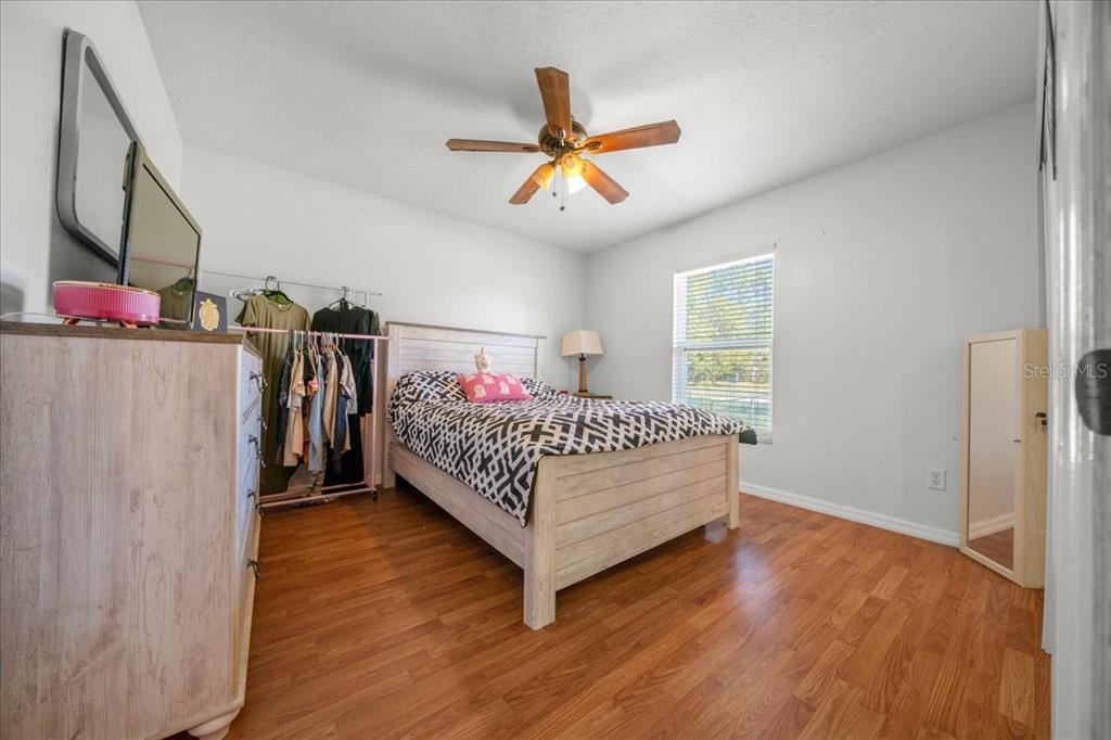 5365 Southwest 111th Lane Road Ocala, FL 34476 - Photo 33 of 42 a bed room with a bed and a window