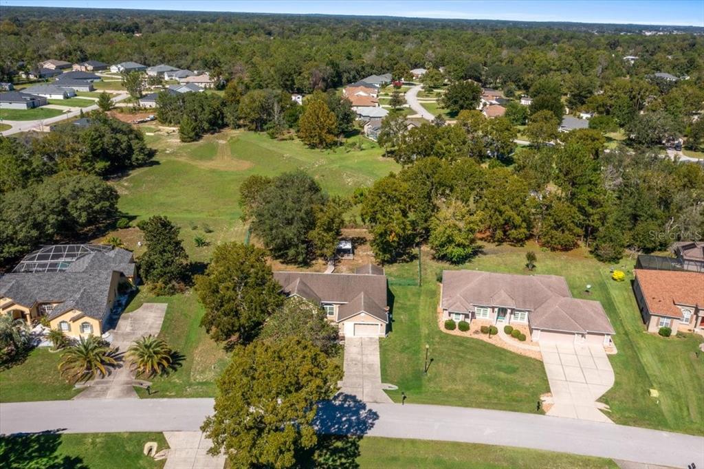 5365 Southwest 111th Lane Road Ocala, FL 34476 - Photo 42 of 42 an aerial view of residential houses with outdoor space and river