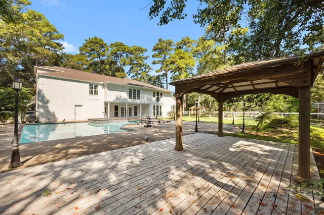 a view of a swimming pool with a yard