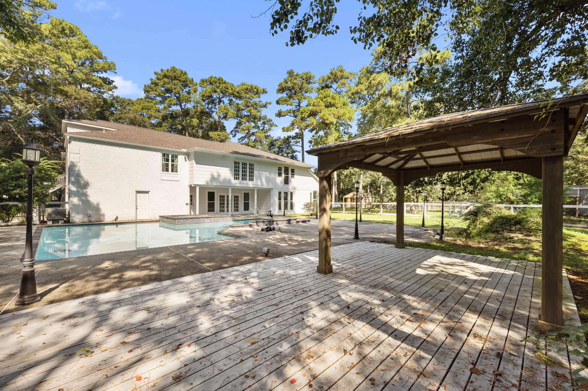 21802 Lindheimer Road Hockley, TX 77447 - Photo 12 of 50 a view of a house with a tree in the background