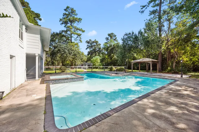 a view of a backyard with trees