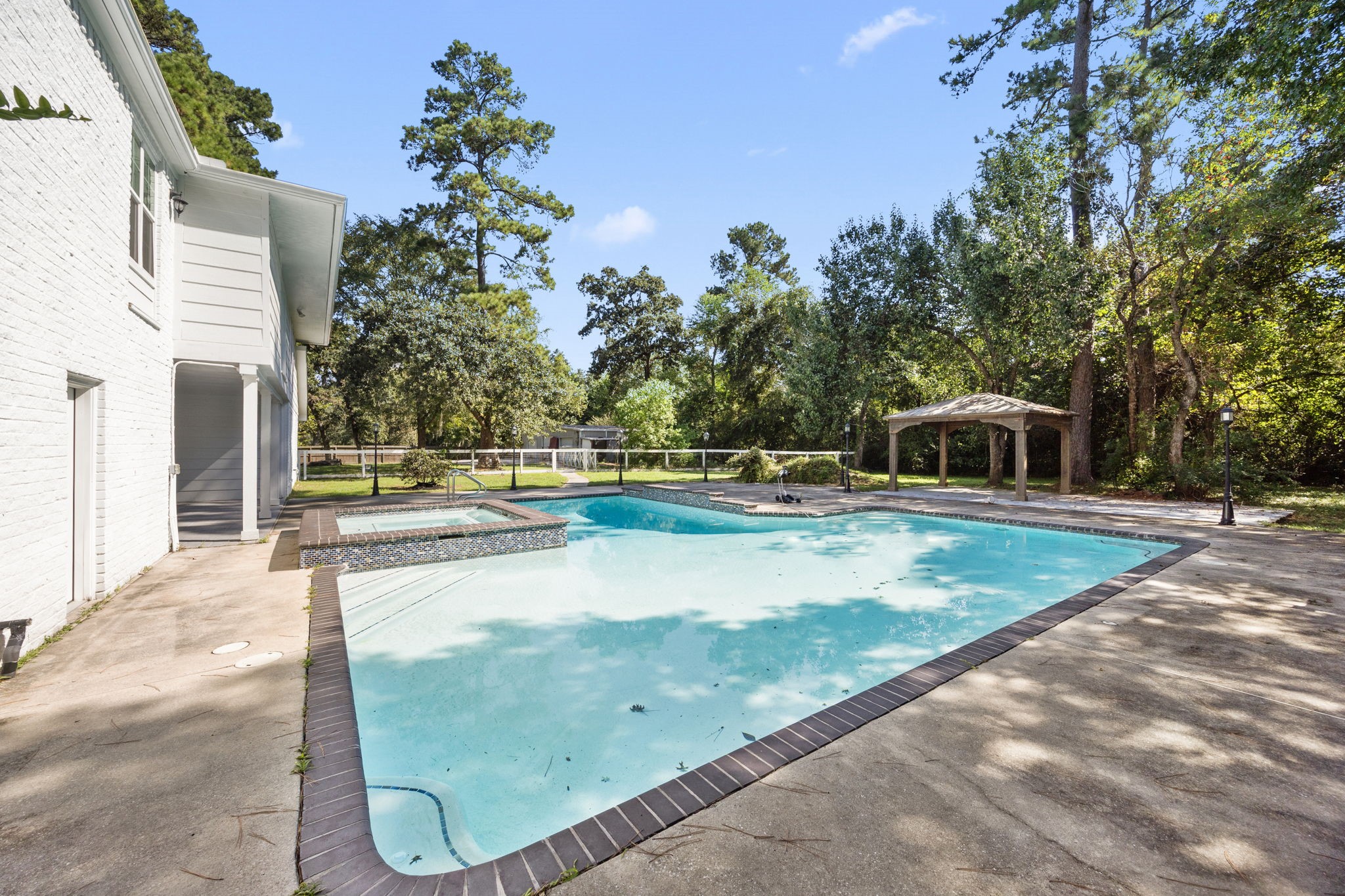 21802 Lindheimer Road Hockley, TX 77447 - Photo 13 of 50 a view of a swimming pool with a yard