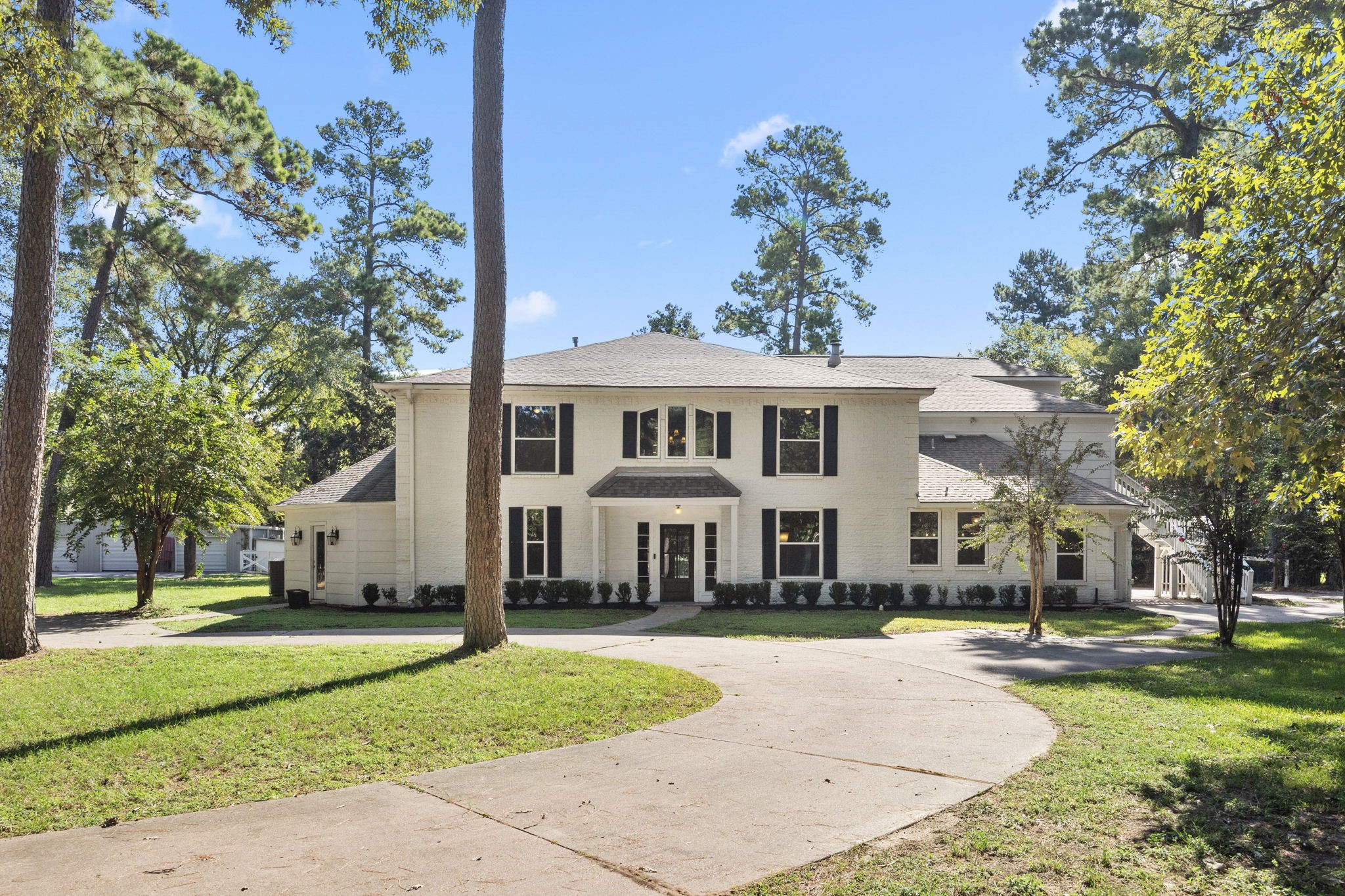 21802 Lindheimer Road Hockley, TX 77447 - Photo 2 of 50 a front view of a house with a yard table and chairs