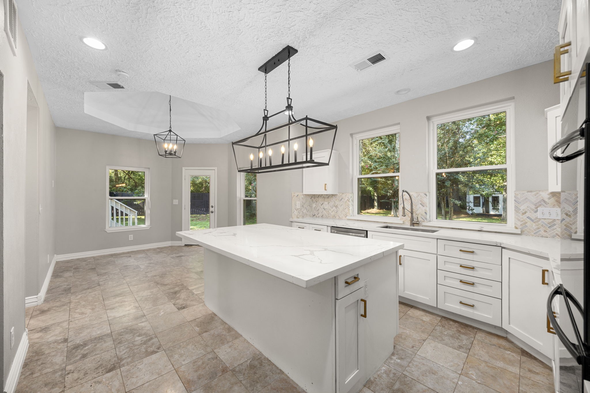 21802 Lindheimer Road Hockley, TX 77447 - Photo 22 of 50 a kitchen that has a sink and a window in it