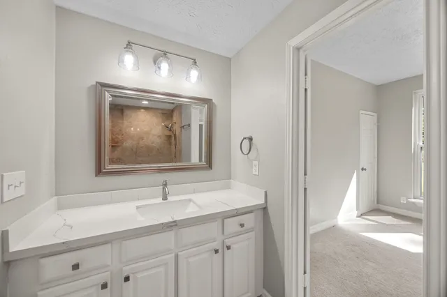 a bathroom with a toilet a sink and bathtub