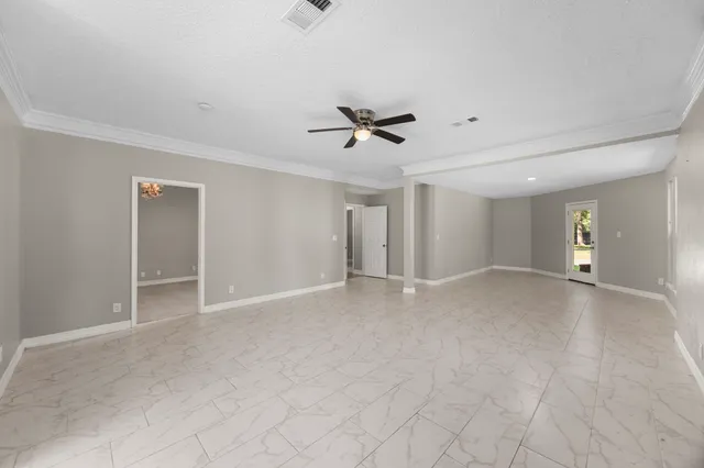 a spacious bathroom with a tub sink and mirror