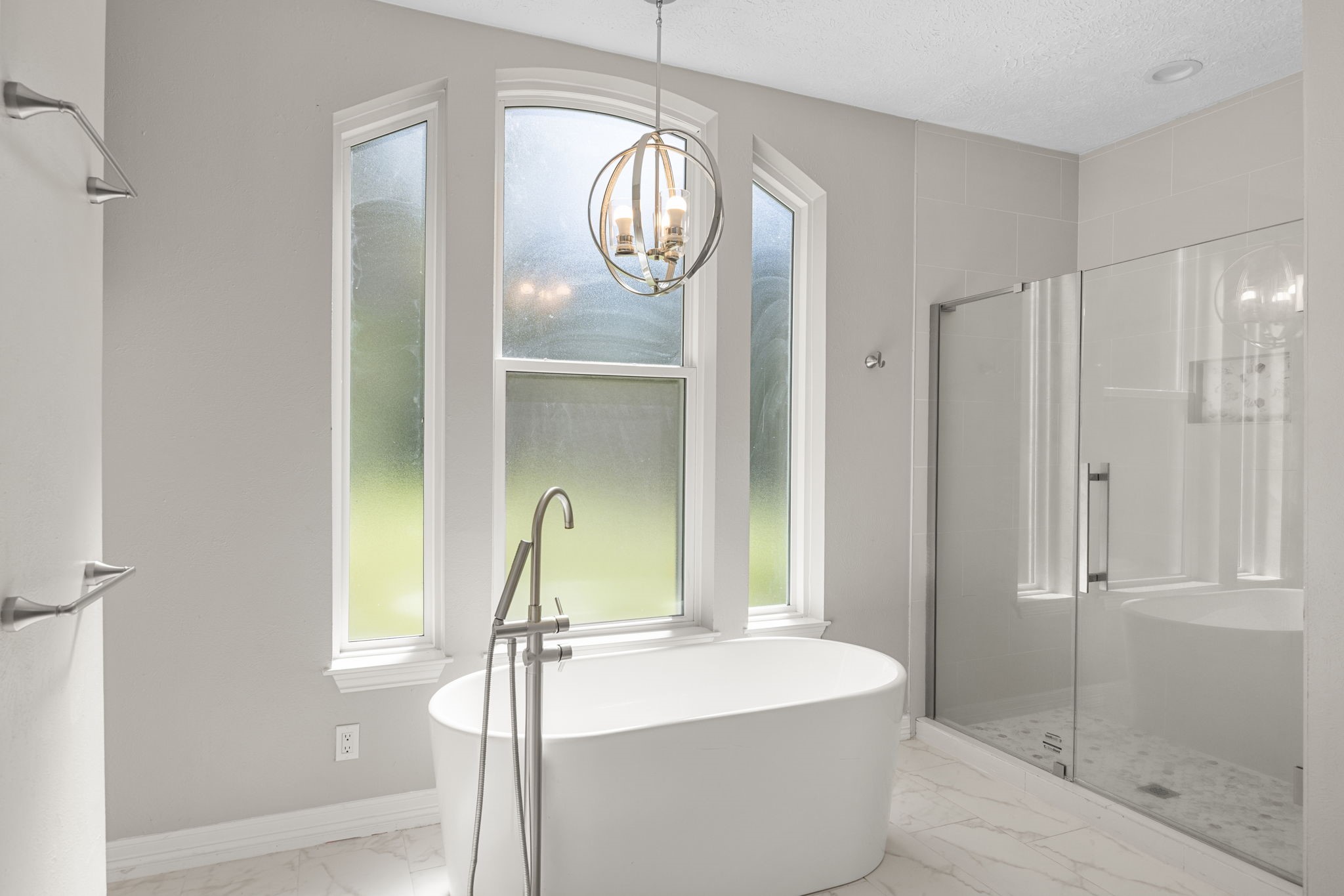 21802 Lindheimer Road Hockley, TX 77447 - Photo 37 of 50 a spacious bathroom with a sink a mirror and a shower