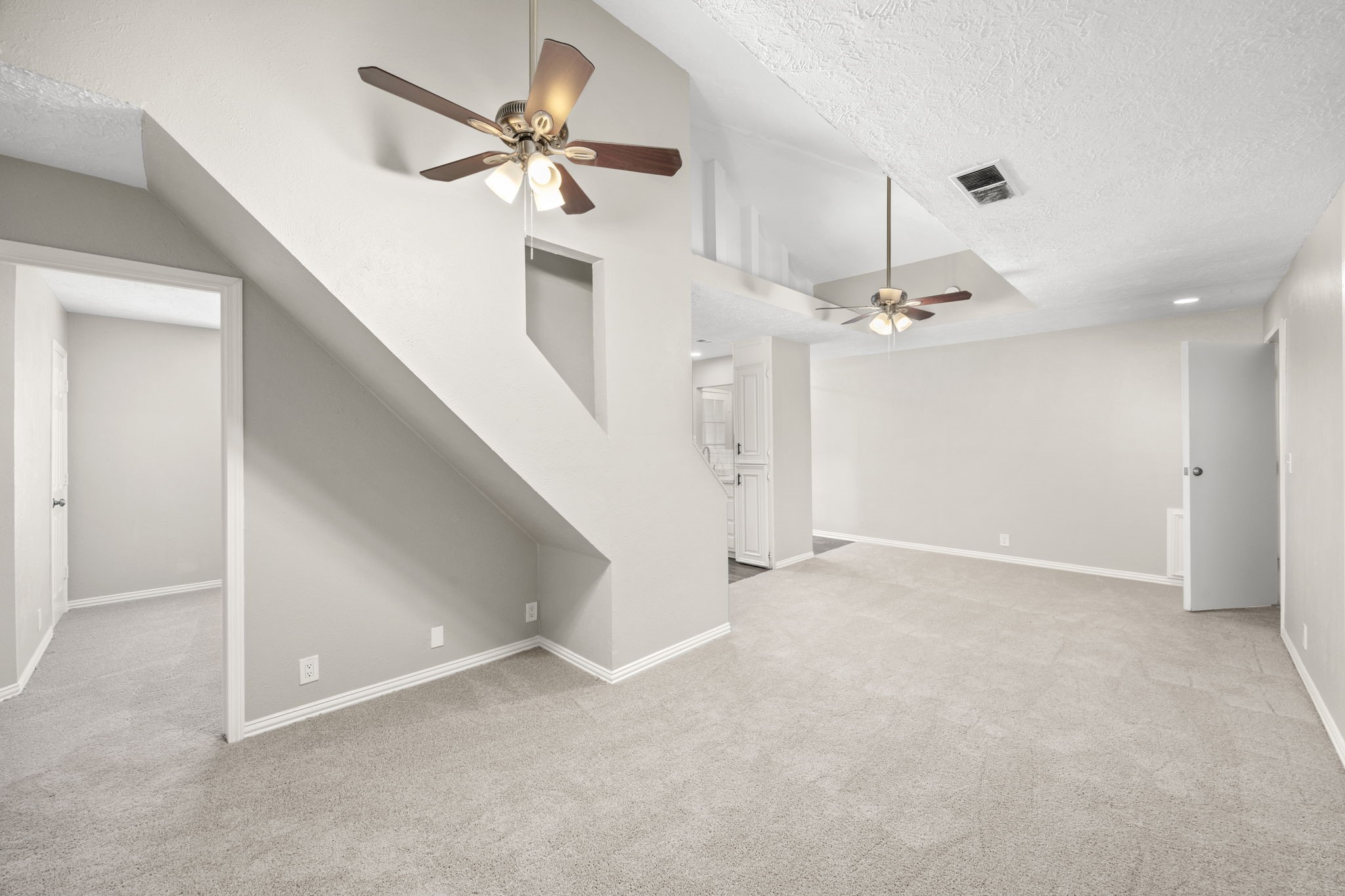 21802 Lindheimer Road Hockley, TX 77447 - Photo 47 of 50 wooden floor in an empty room with a ceiling fan