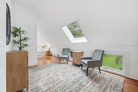 a bathroom with a shower and a mirror