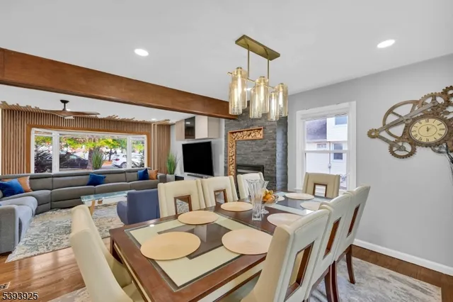 a living room with fireplace furniture and a flat screen tv