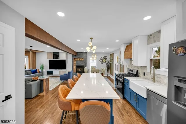 a bed sitting in a spacious bedroom next to a window