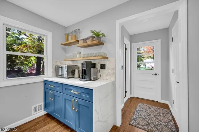 a bathroom with a sink toilet and a mirror