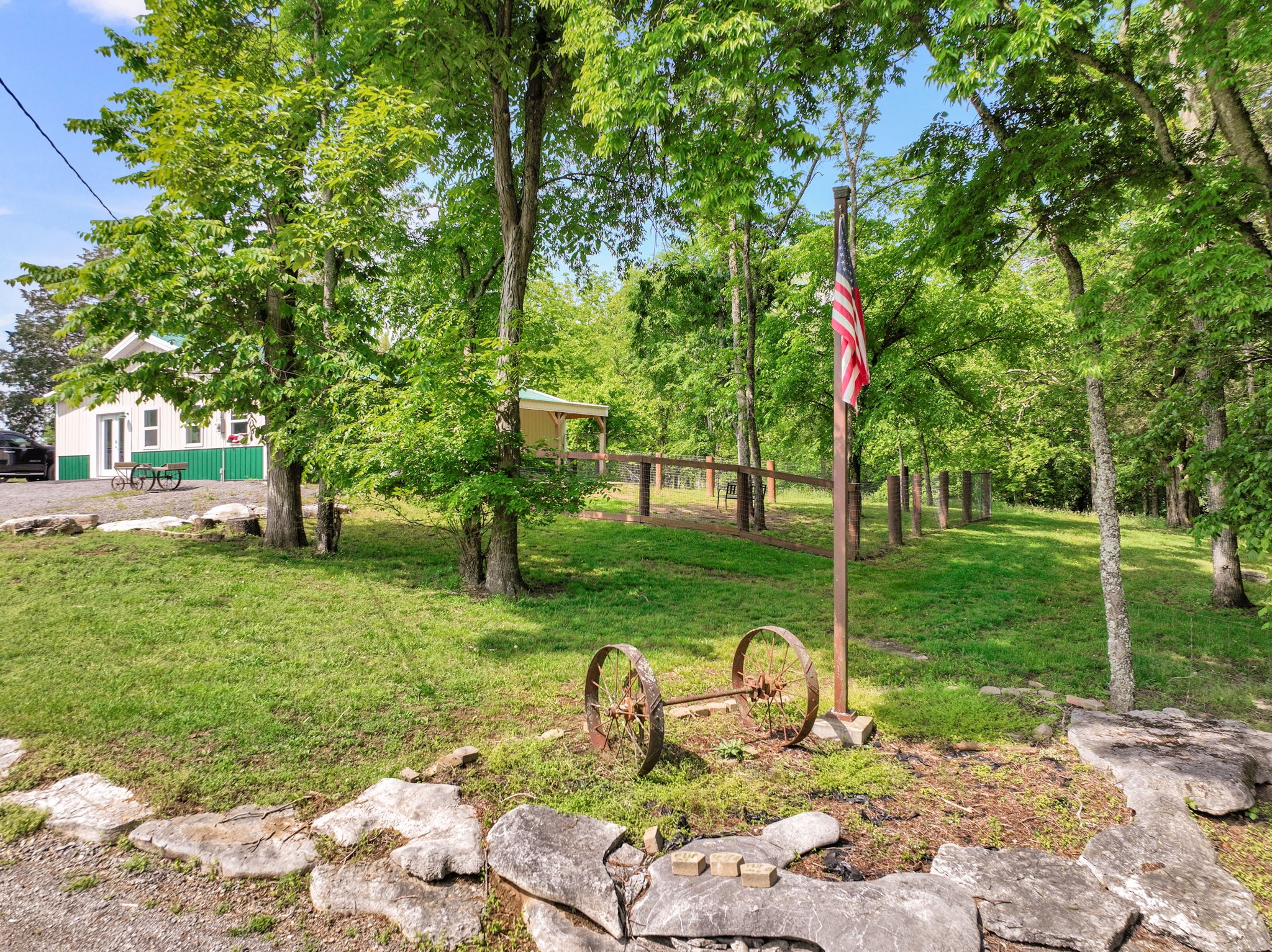 3079 Cairo Bend Road Lebanon, TN 37087 - Photo 7 of 67 a wooden bench sitting in the middle of a park