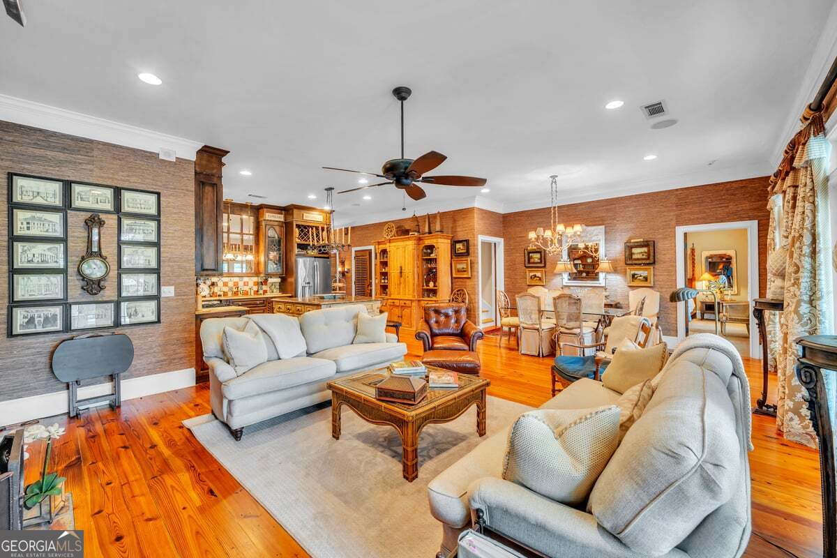 696 Cork Ferry Road Cordele, GA 31015 - Photo 11 of 79 a living room with furniture a rug and a chandelier