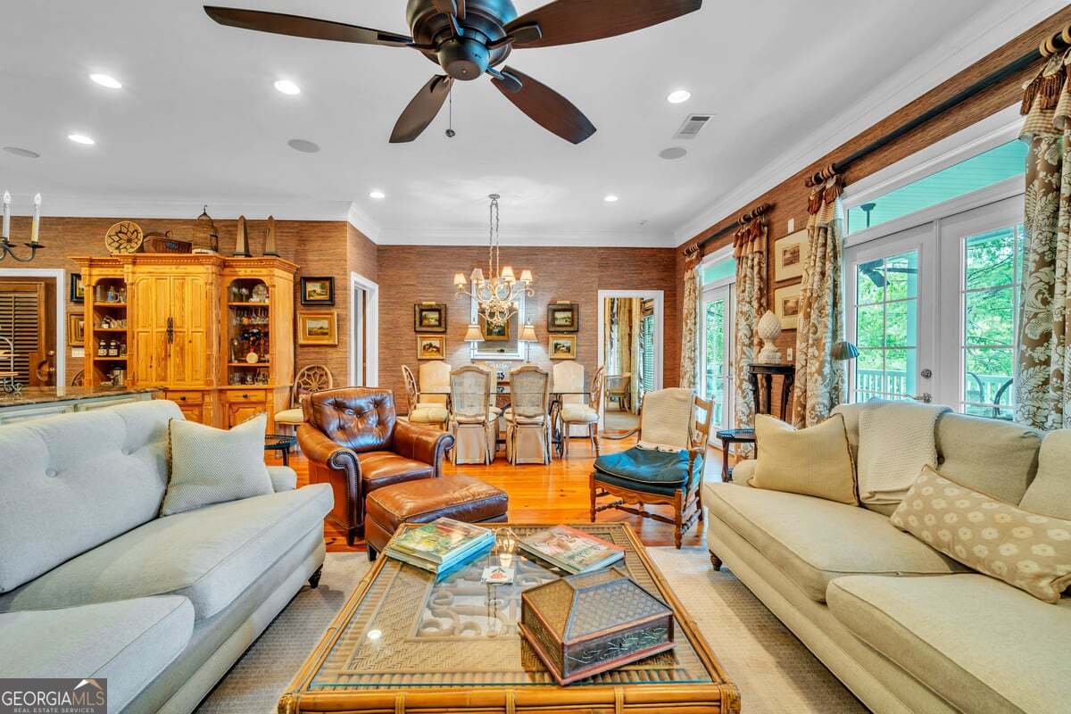 696 Cork Ferry Road Cordele, GA 31015 - Photo 12 of 79 a living room with furniture ceiling fan and a large window