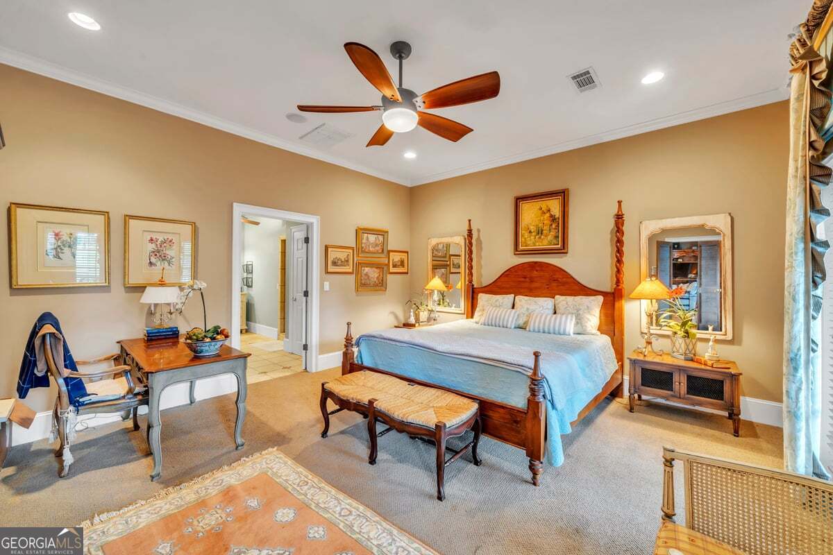 696 Cork Ferry Road Cordele, GA 31015 - Photo 21 of 79 a bedroom with a bed and a chandelier