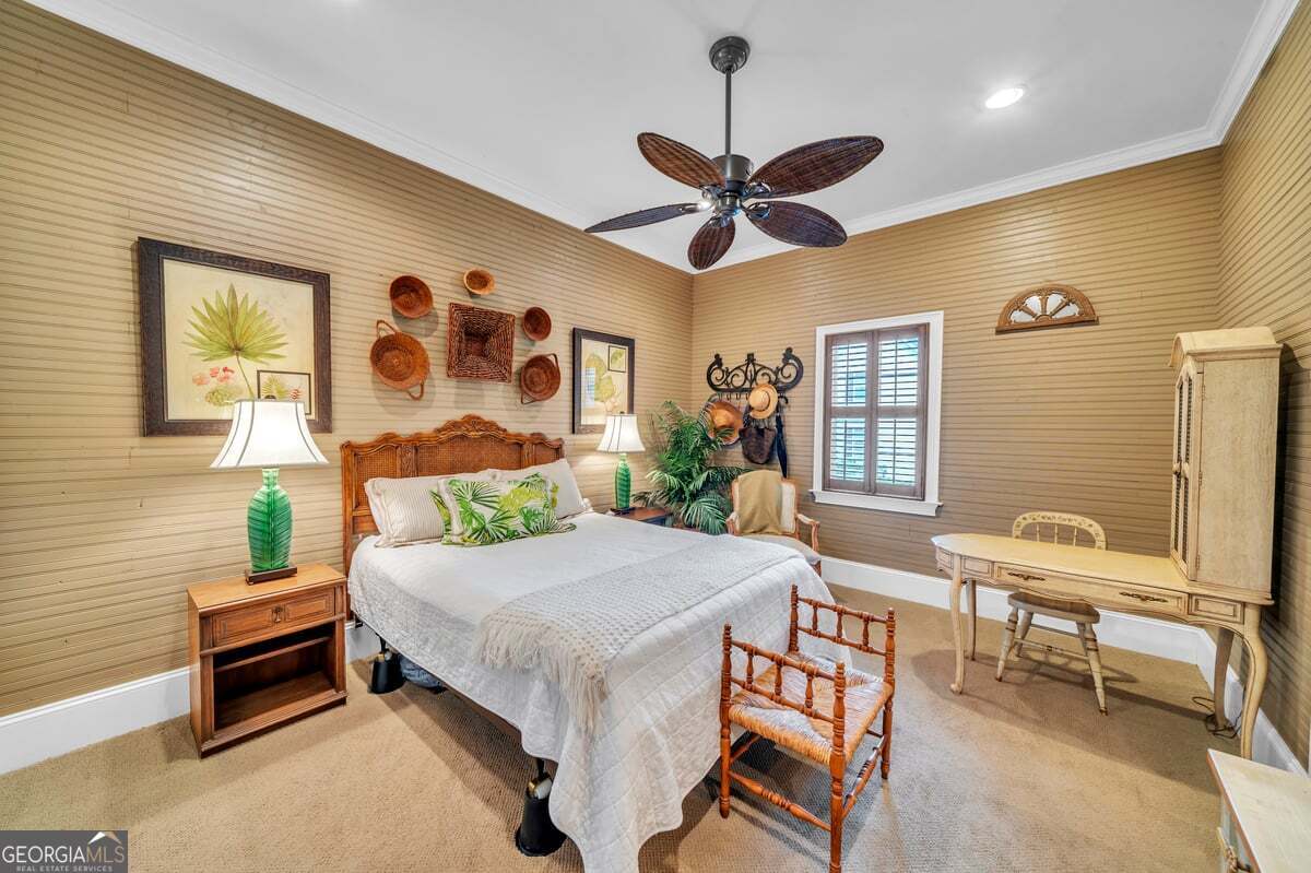 696 Cork Ferry Road Cordele, GA 31015 - Photo 31 of 79 a bedroom with a bed and a chandelier