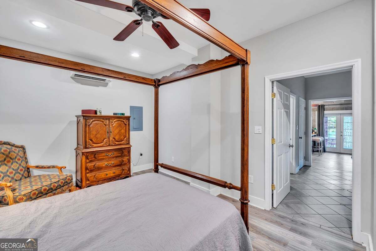696 Cork Ferry Road Cordele, GA 31015 - Photo 49 of 79 a bedroom with a bed and cabinets