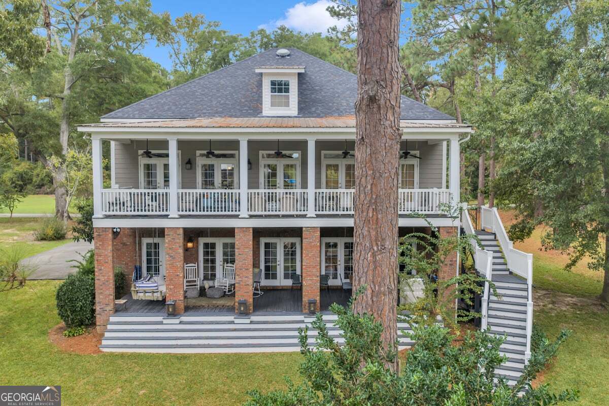 696 Cork Ferry Road Cordele, GA 31015 - Photo 53 of 79 a front view of a house with a porch