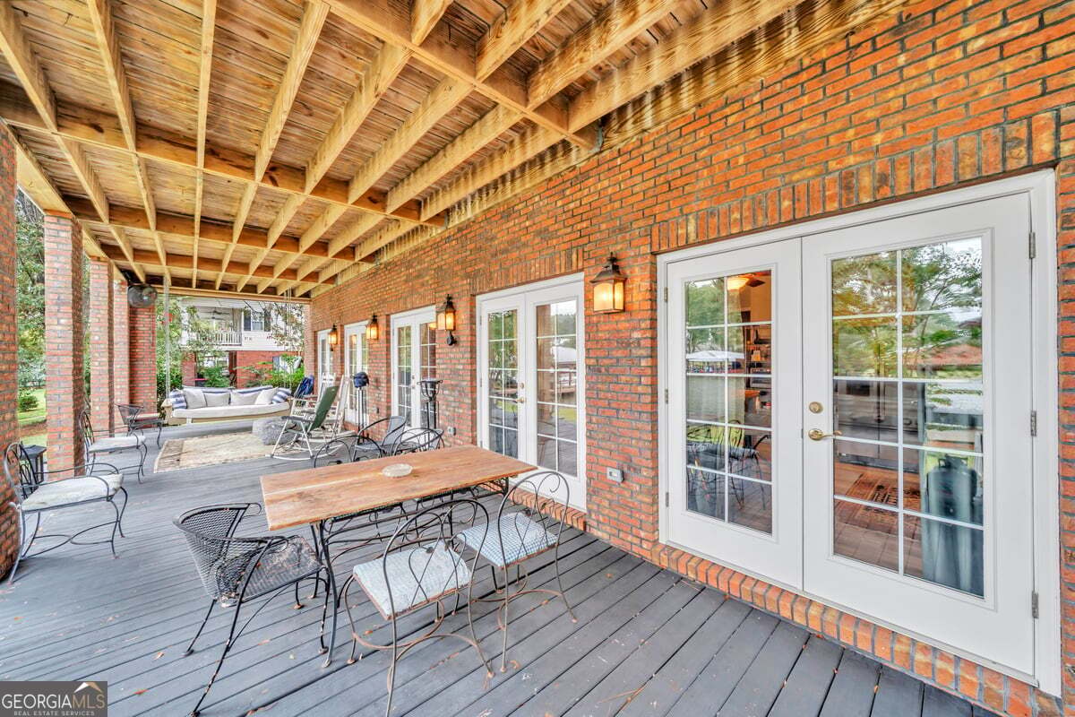 696 Cork Ferry Road Cordele, GA 31015 - Photo 58 of 79 a outdoor space with wooden floor and furniture