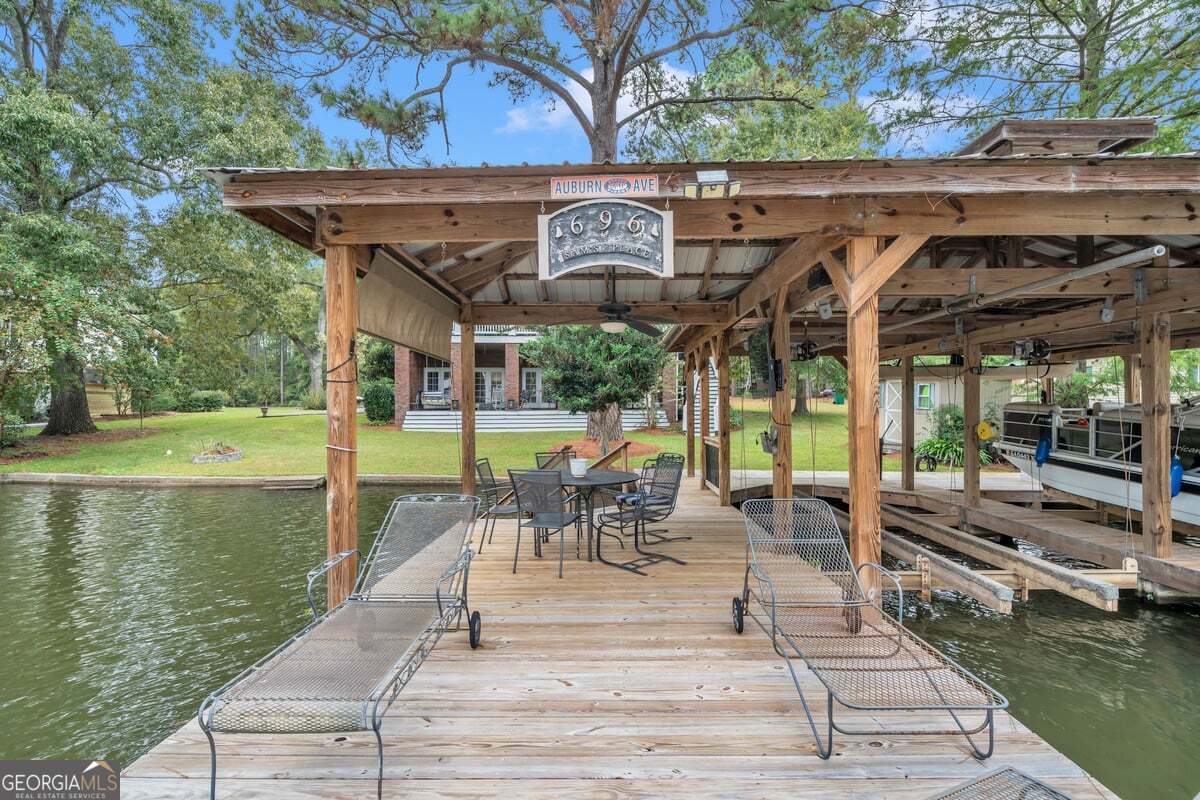 696 Cork Ferry Road Cordele, GA 31015 - Photo 65 of 79 a view of a patio with a table chairs and a patio