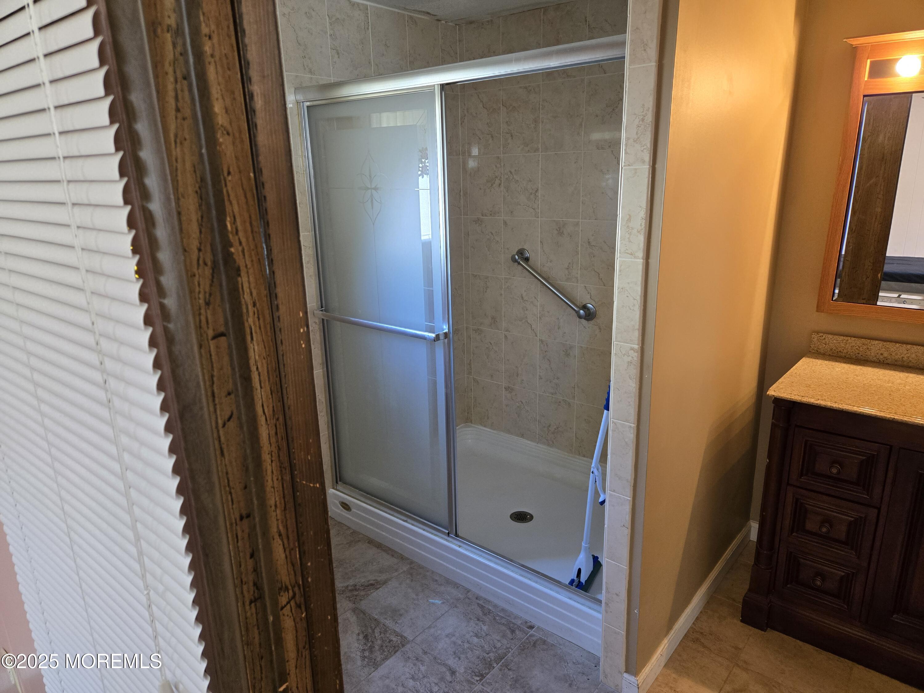 35 Boxwood Drive Jackson, NJ 08527 - Photo 8 of 10 a bathroom with a shower and a sink