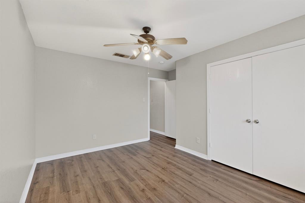 3401 Newgate Street Midlothian, TX 76065 - Photo 28 of 34 Room featuring wood-finish flooring, a ceiling fan with integrated lighting, and light gray wall paint