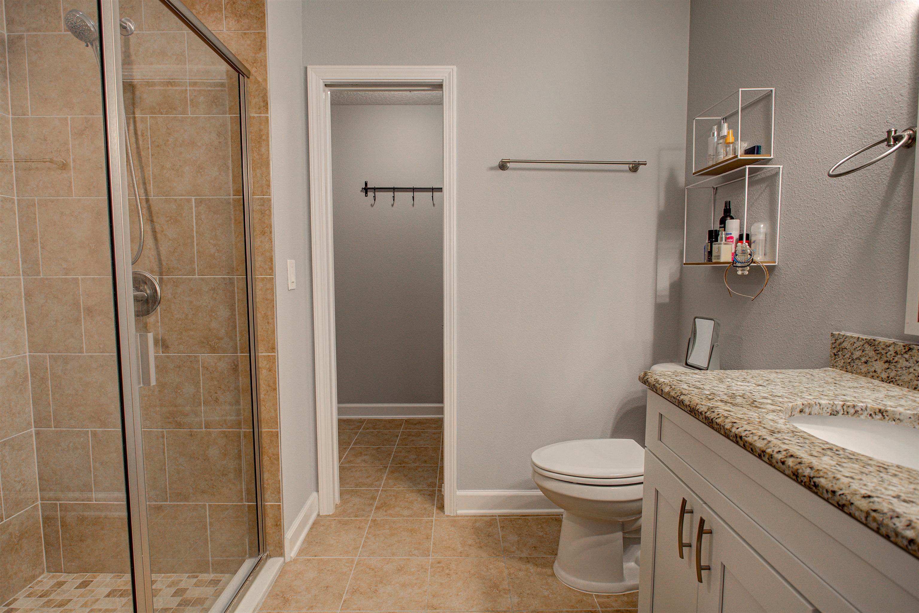 101 Linden Road St. Augustine, FL 32086 - Photo 11 of 21 a bathroom with a granite countertop sink toilet and shower