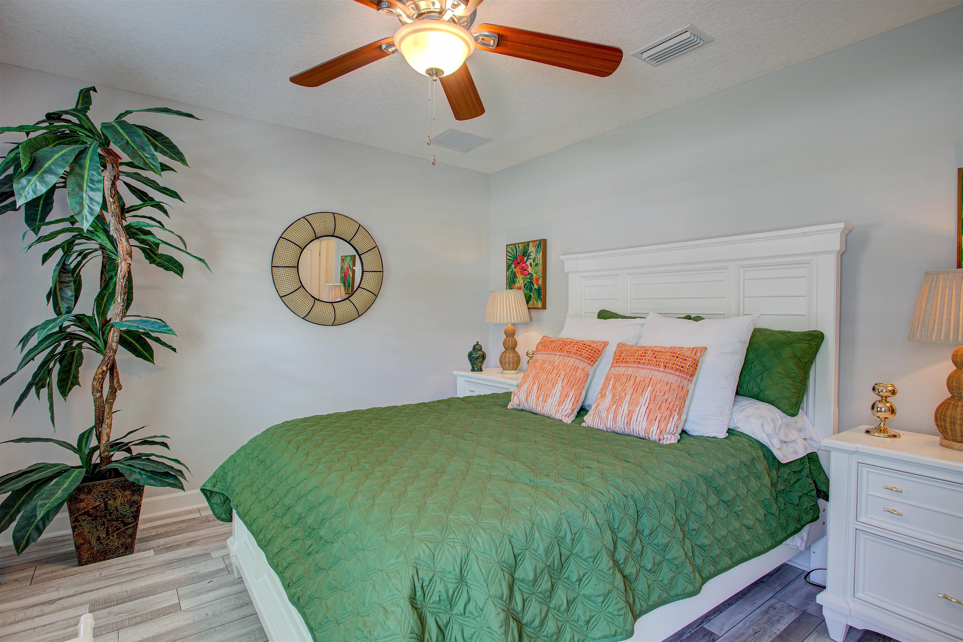 101 Linden Road St. Augustine, FL 32086 - Photo 13 of 21 a bedroom with a large bed and a chandelier