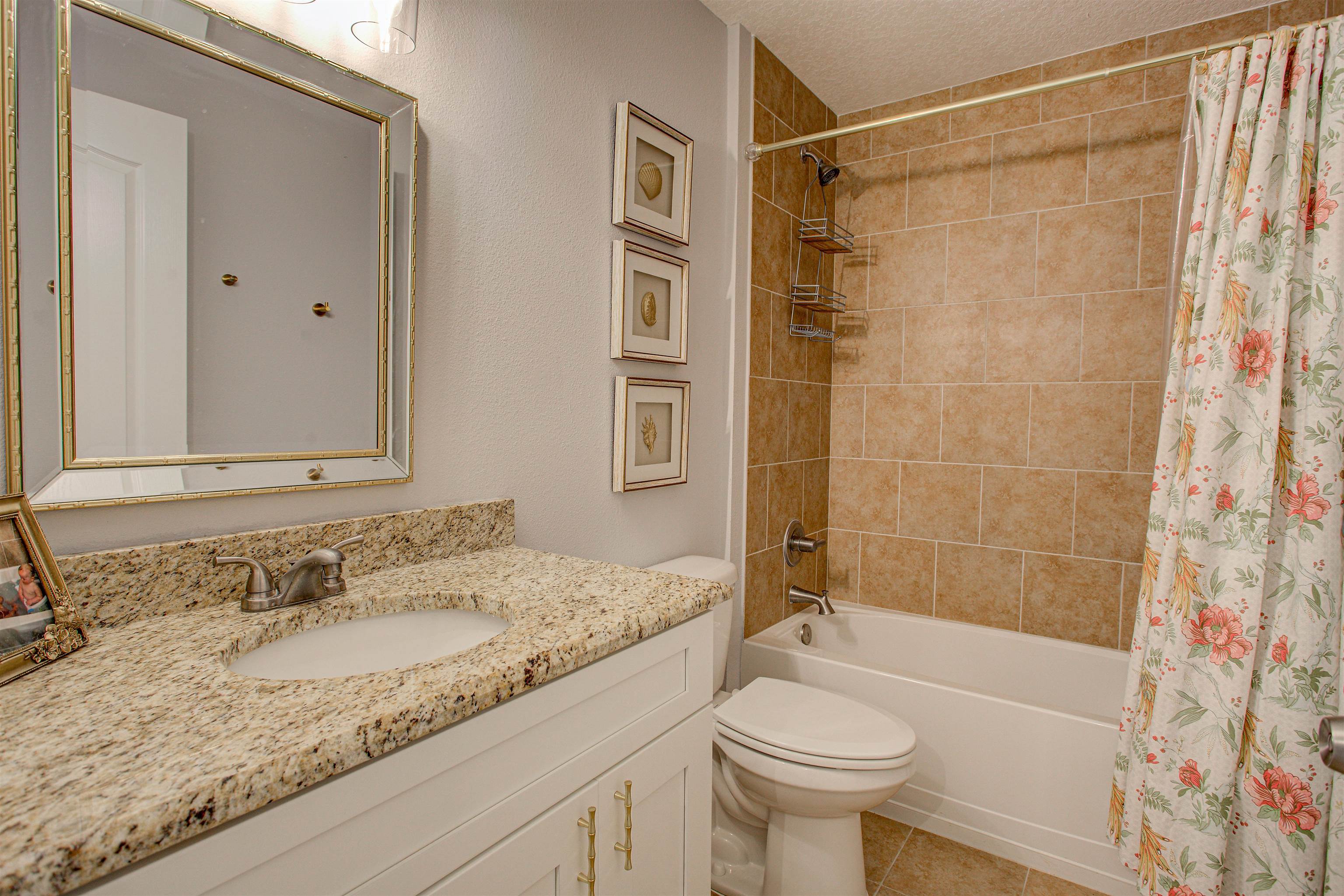 101 Linden Road St. Augustine, FL 32086 - Photo 15 of 21 a bathroom with a granite countertop sink toilet and shower