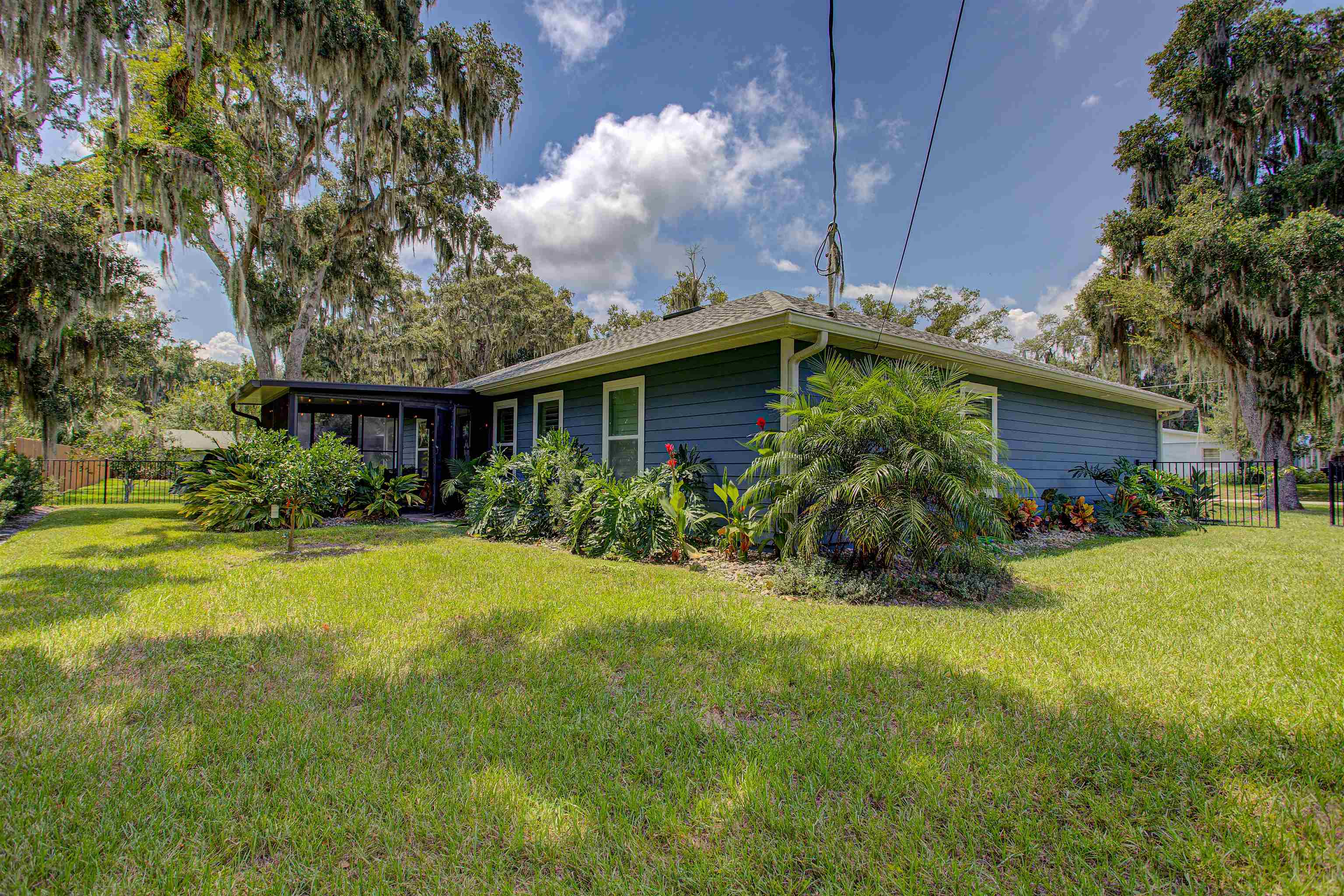 101 Linden Road St. Augustine, FL 32086 - Photo 17 of 21 a view of a house with a yard and potted plants