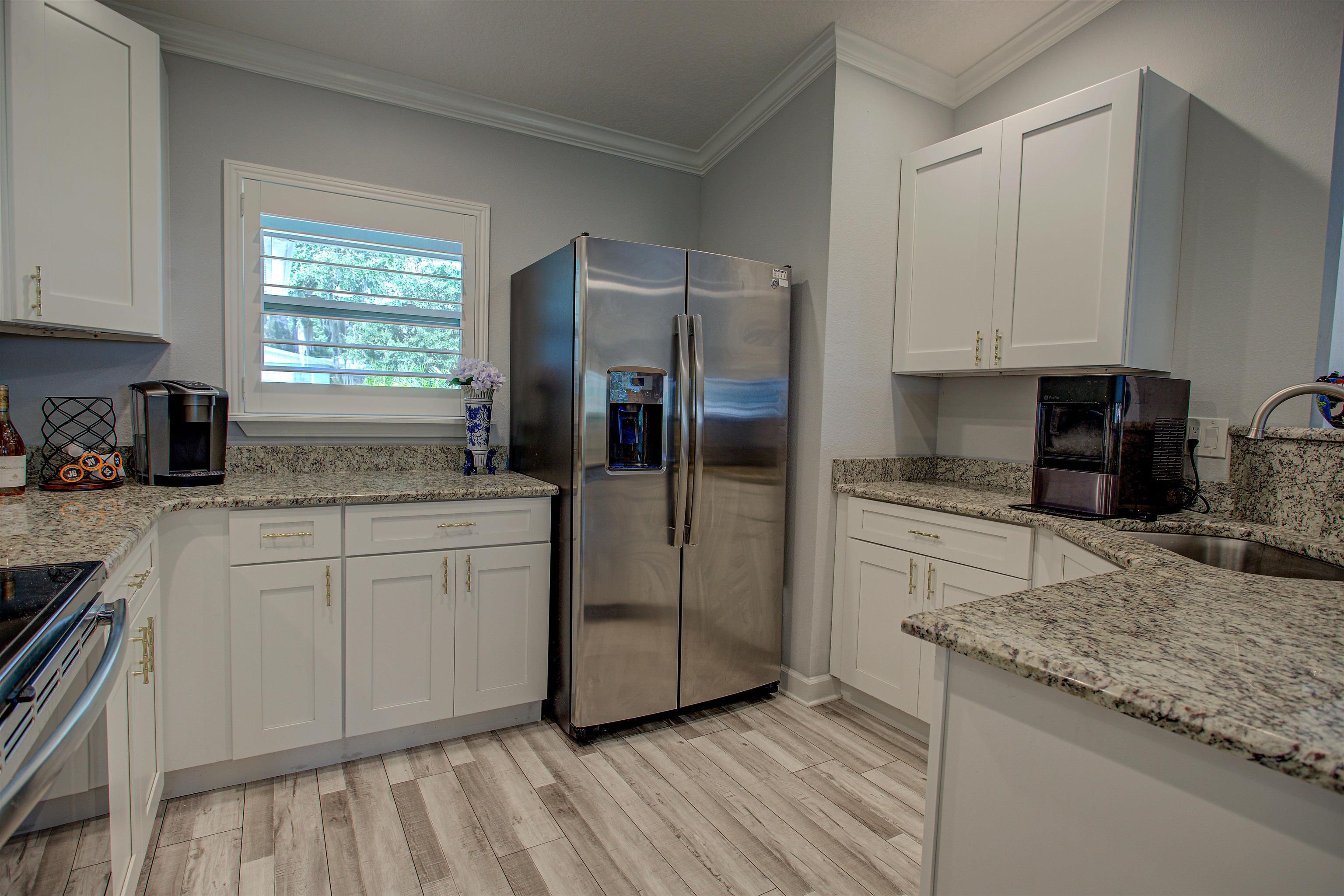 101 Linden Road St. Augustine, FL 32086 - Photo 7 of 21 a kitchen with stainless steel appliances granite countertop a refrigerator and a sink