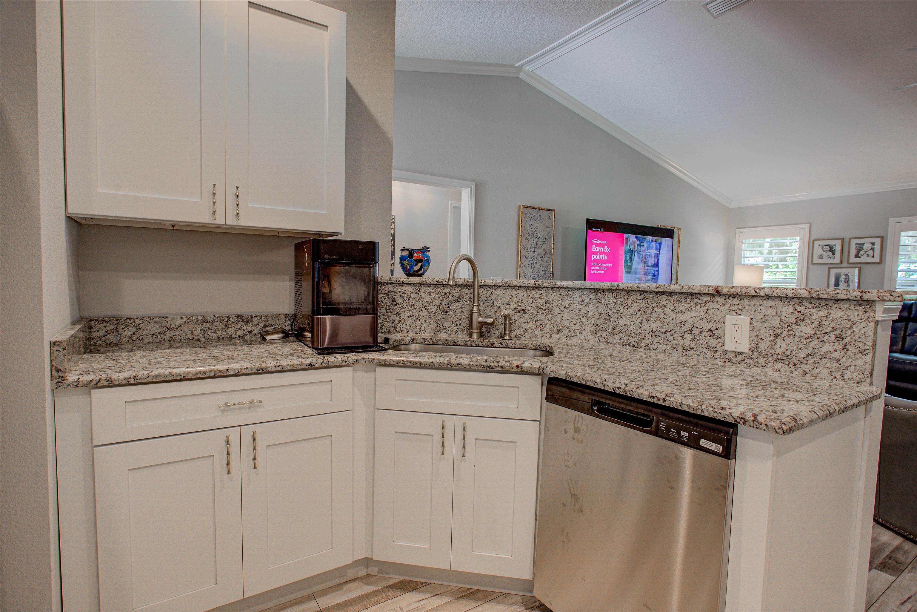 101 Linden Road St. Augustine, FL 32086 - Photo 8 of 21 a kitchen with granite countertop cabinets and white appliances