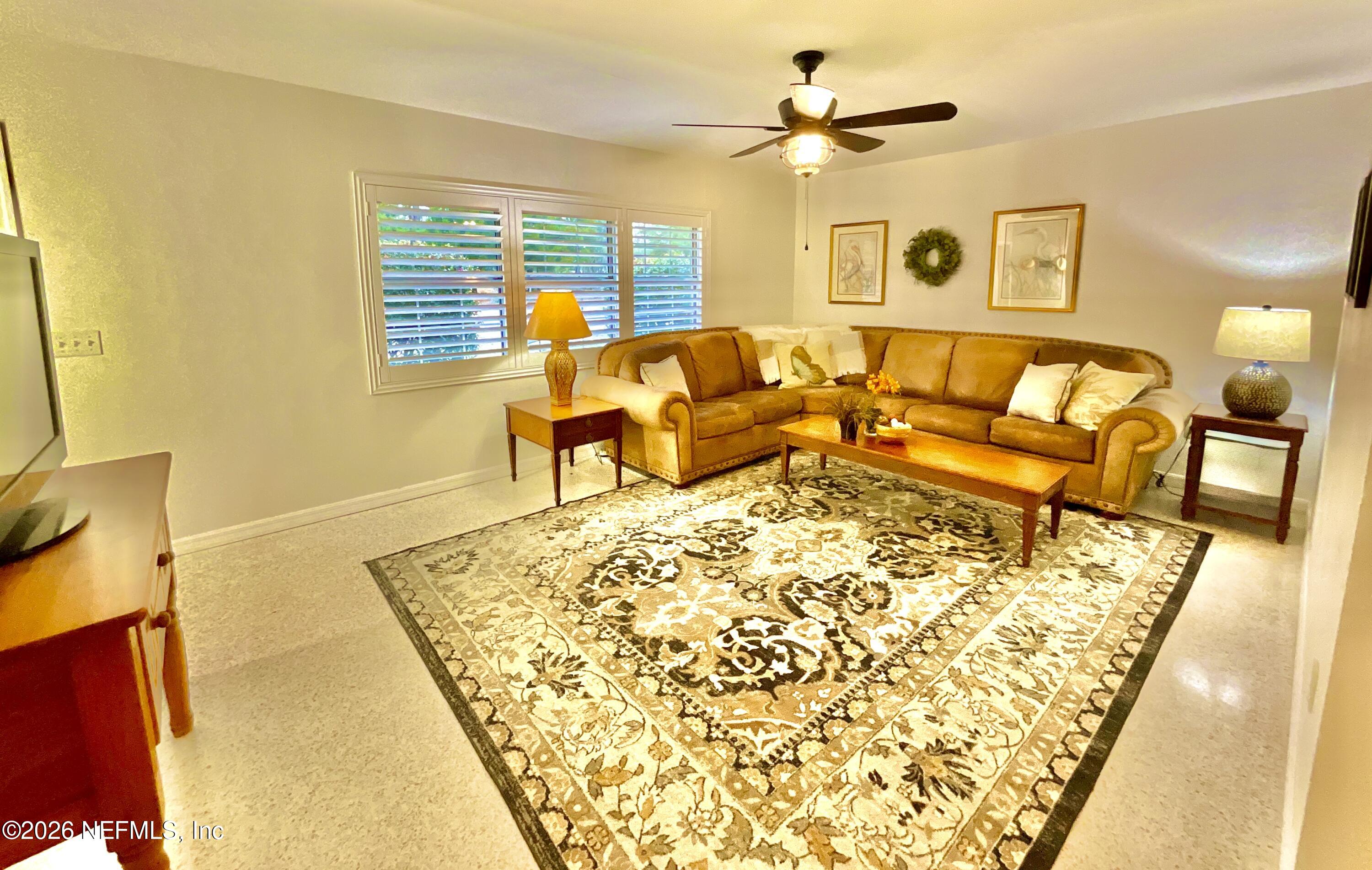 17221 Northeast 77th Lane Hawthorne, FL 32640 - Photo 17 of 59 a living room with furniture and a rug
