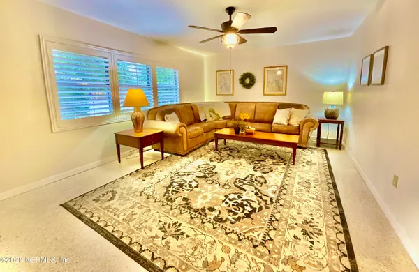a kitchen with stainless steel appliances granite countertop sink stove and refrigerator