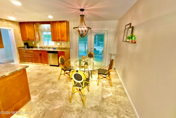a bathroom with a sink mirror vanity and toilet