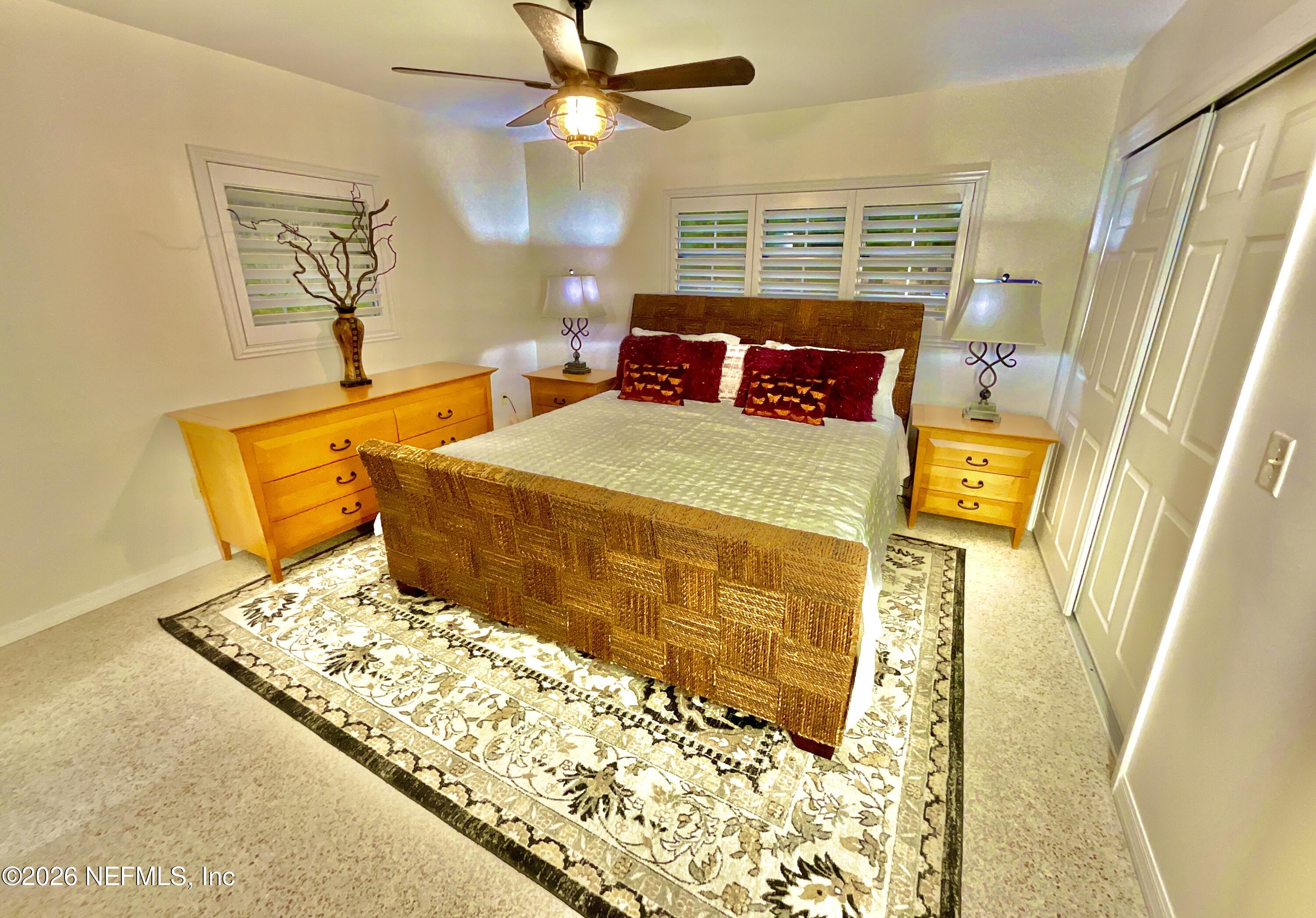 17221 Northeast 77th Lane Hawthorne, FL 32640 - Photo 28 of 59 a bedroom with a bed and a window