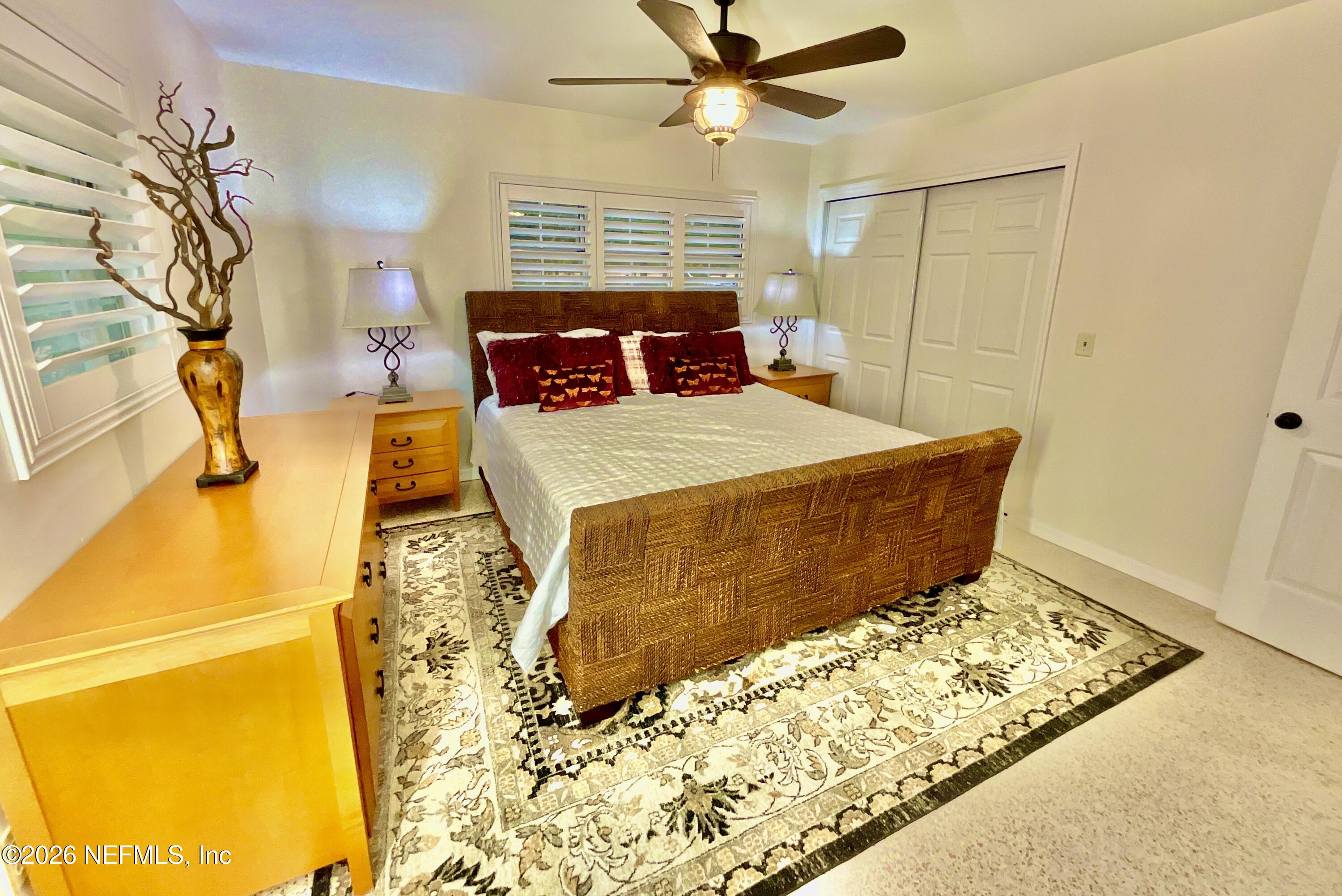 17221 Northeast 77th Lane Hawthorne, FL 32640 - Photo 29 of 59 a bedroom with a bed and a window