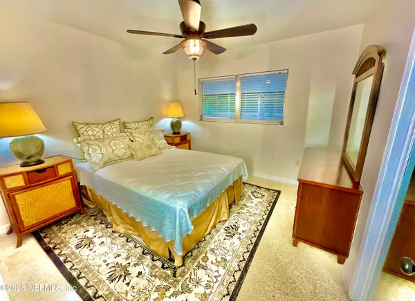 a view of a bedroom with a natural light