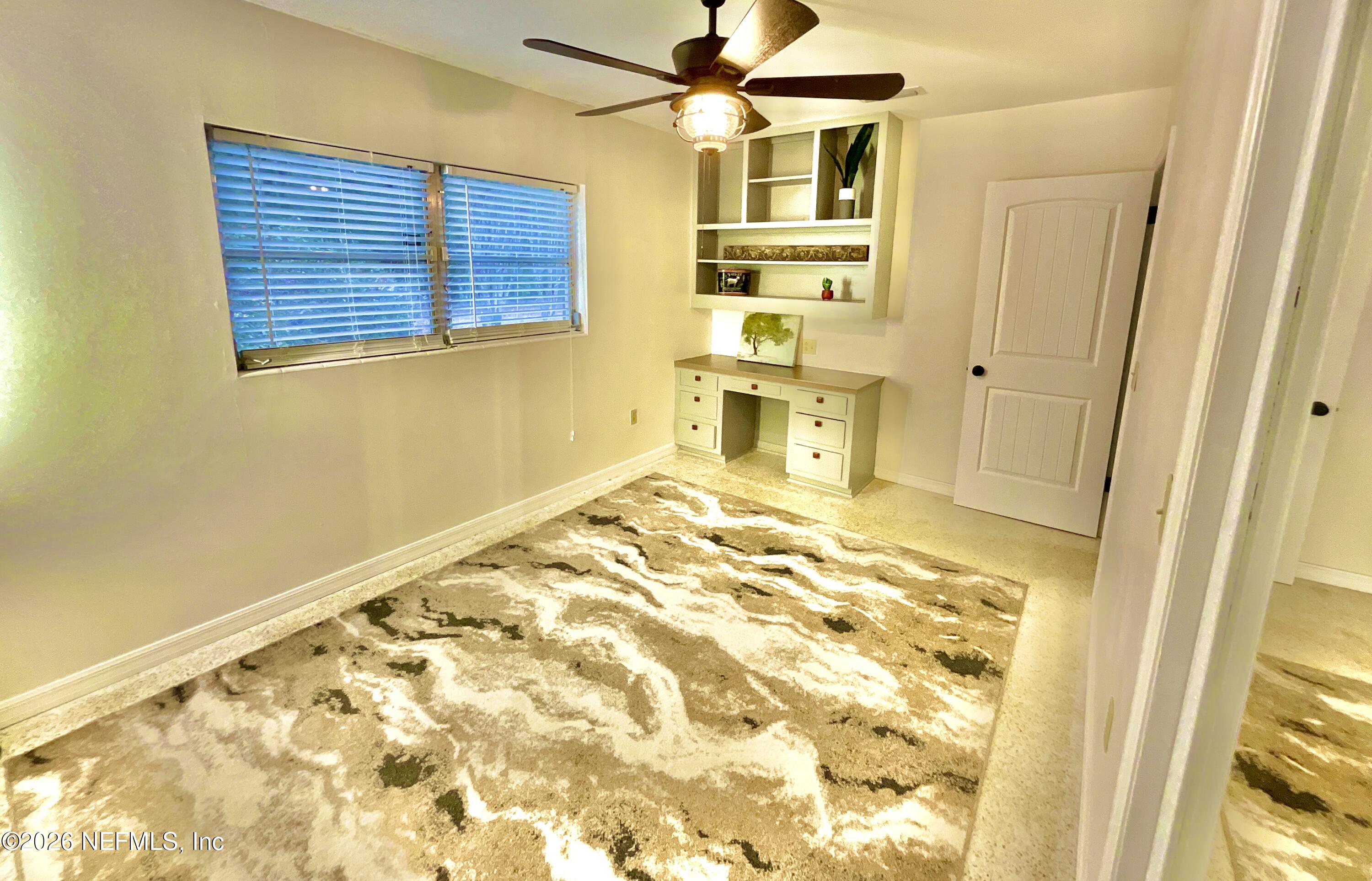 17221 Northeast 77th Lane Hawthorne, FL 32640 - Photo 34 of 59 a view of a bedroom with a window