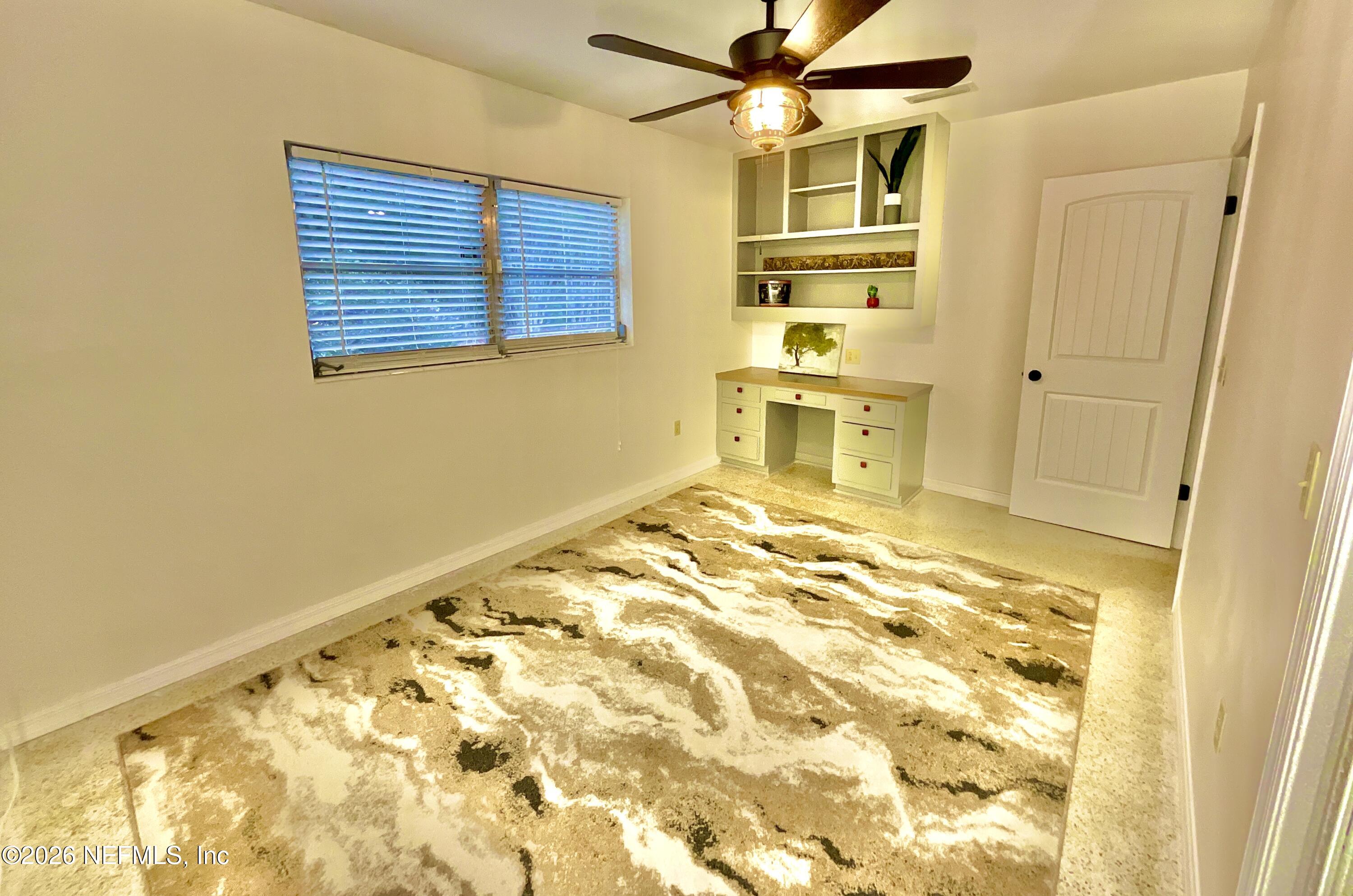 17221 Northeast 77th Lane Hawthorne, FL 32640 - Photo 37 of 59 a view of a bedroom with wooden floor and ceiling fan