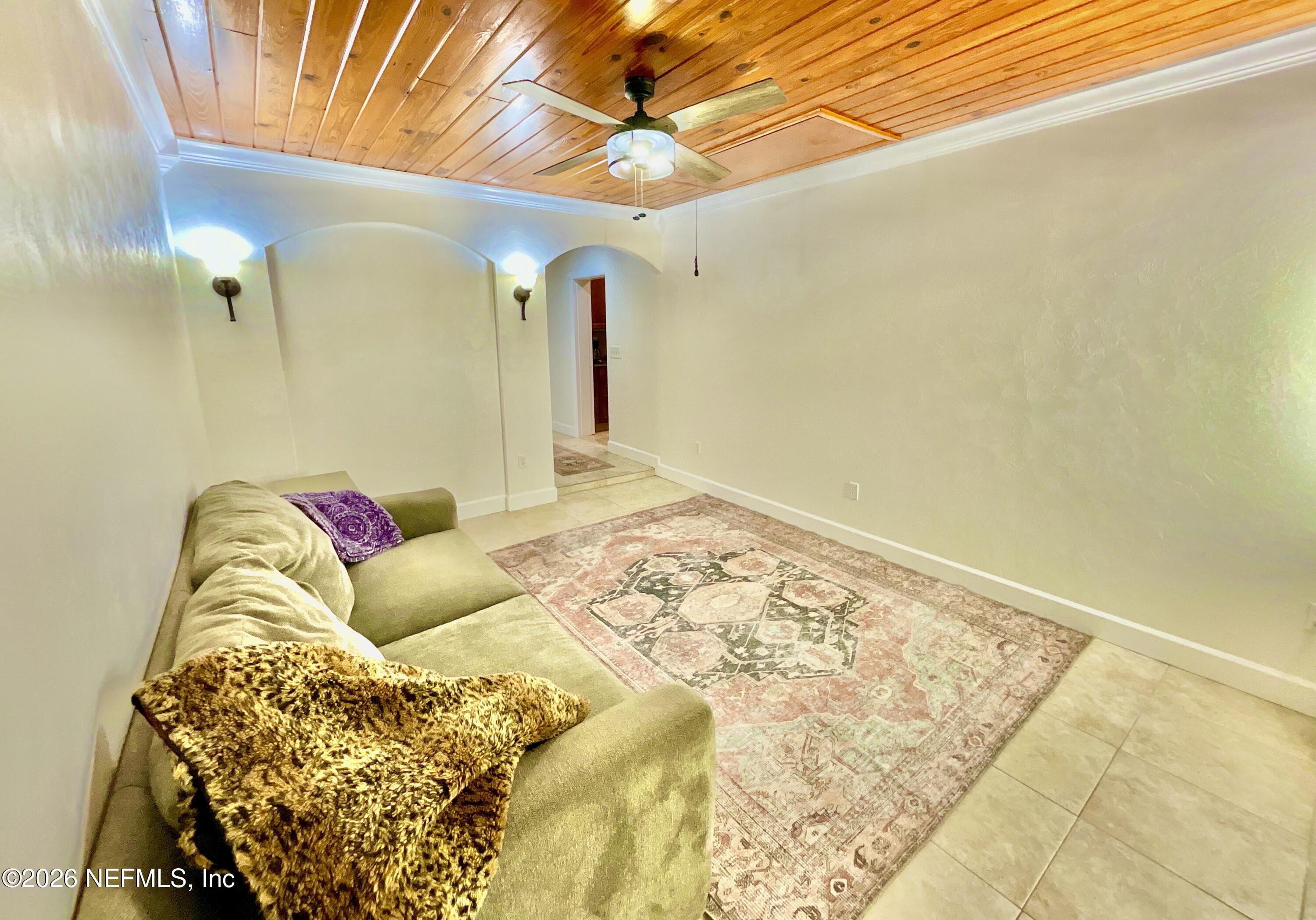 17221 Northeast 77th Lane Hawthorne, FL 32640 - Photo 40 of 59 a bedroom with a bed and ceiling fan