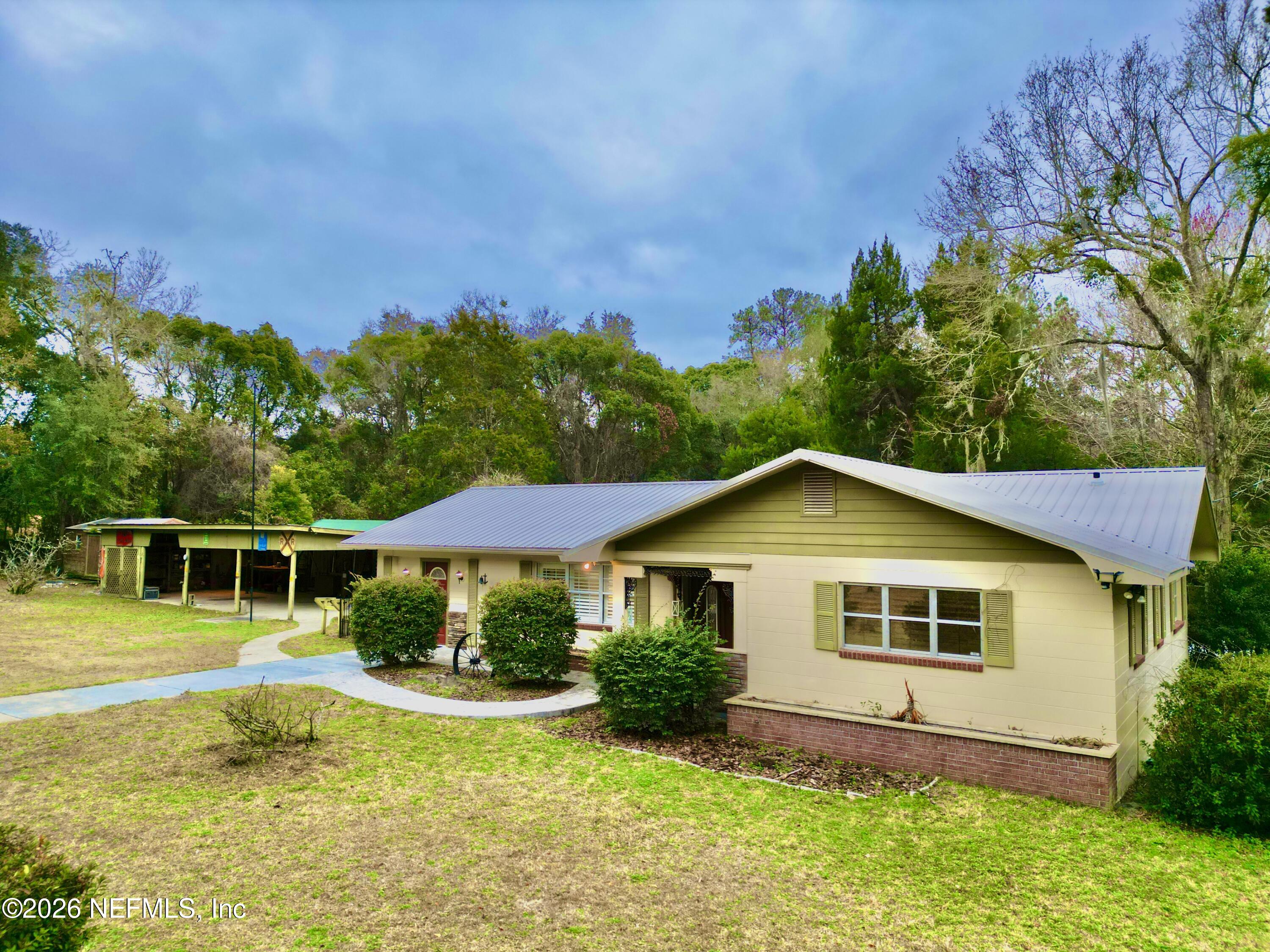 17221 Northeast 77th Lane Hawthorne, FL 32640 - Photo 10 of 59 a view of a house with a yard