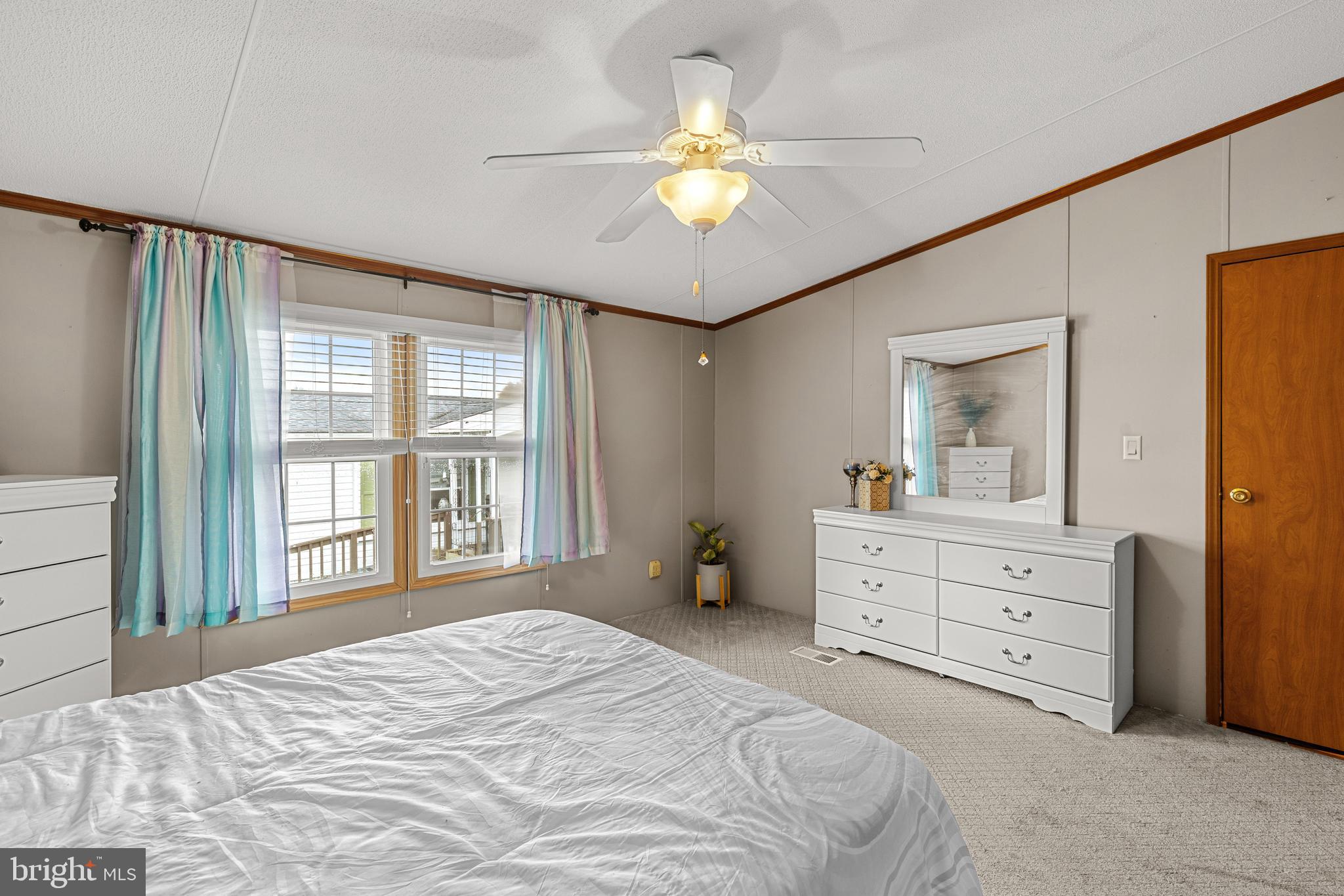 111 Pheasant Ridge Circle Lancaster, PA 17603 - Photo 18 of 29 a bedroom with a bed and a chandelier